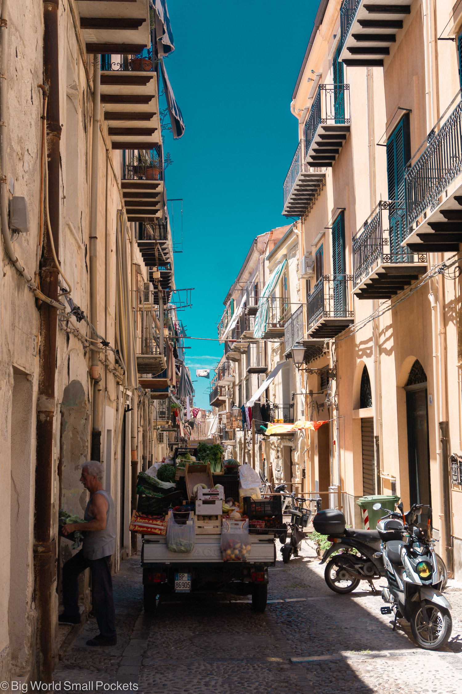 Sicily, Cefalu, Street with Fruit Seller