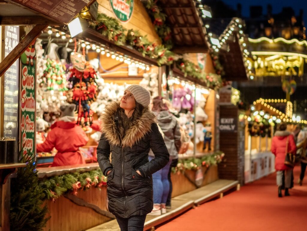 Vienna, Schönbrunn Palace Christmas Market, Women Walking Past Stall