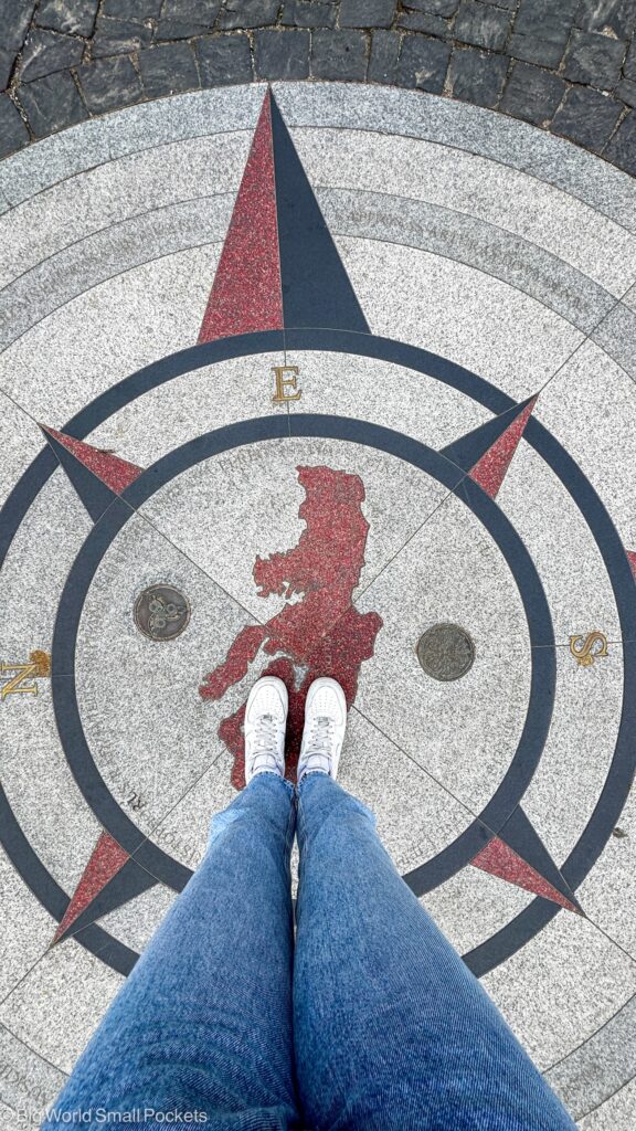 Lithuania, Vilnius, Feet on Compass