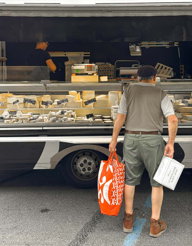 France, Haute Garonne, Man at Cheese Market