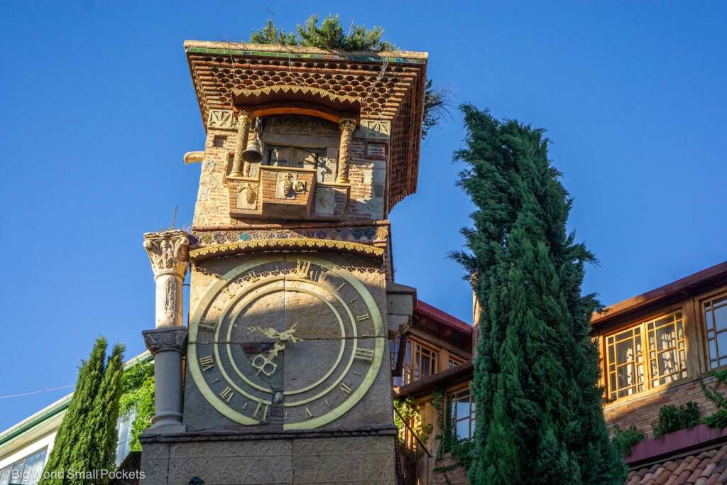 Georgia, Tbilisi, Wonky Clock with Blue Sky Behind